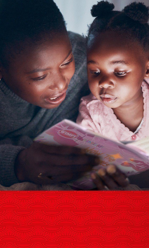 Mother and child reading a book together