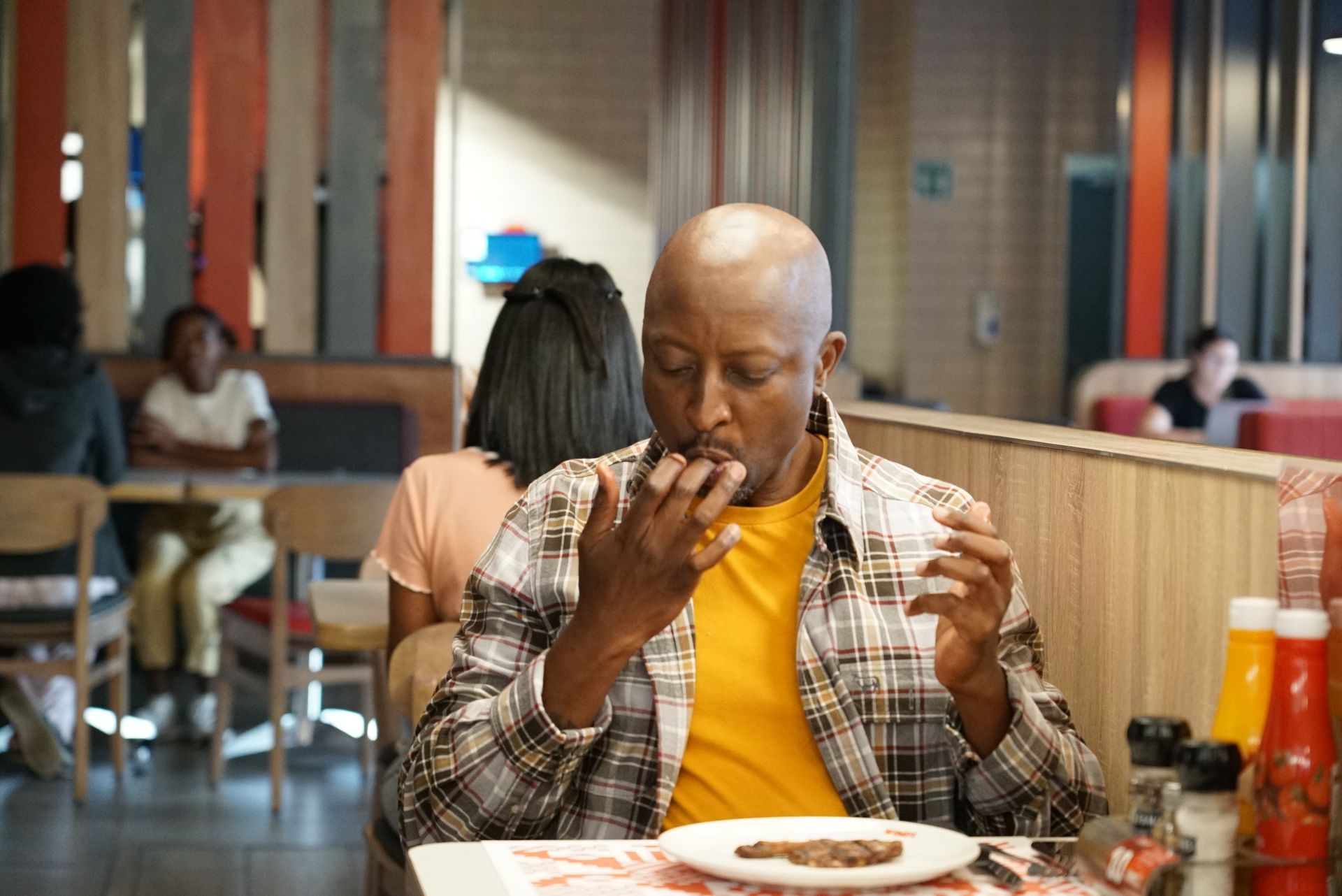 Young person enjoying a meal at wimpy